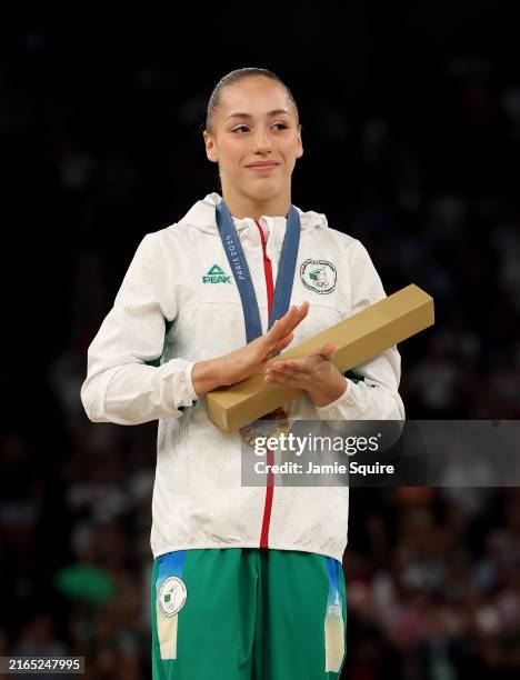 Gold medalist Kaylia Nemour of Team Algeria looks on from the podium during the medal ceremony for the Artistic Gymnastics Women's Uneven Bars Final...