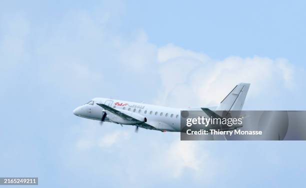 Saab 340A from RAF-Avia takes off from Brussels-National Airport on August 7, 2024 in Zaventem, Belgium. The Saab 340 is a Swedish twin-engine...