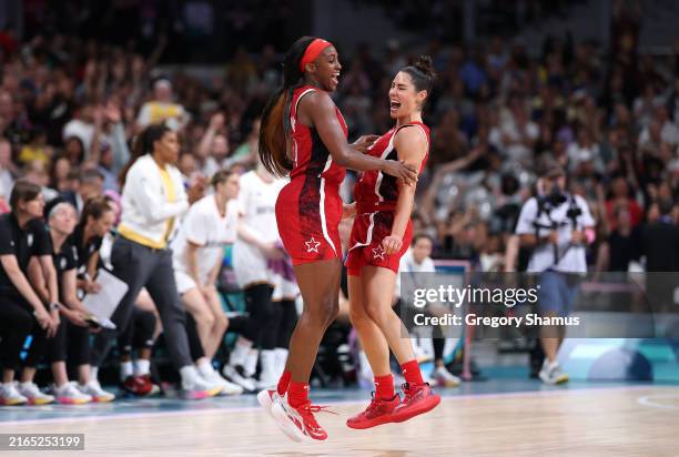 Jackie Young and Kelsey Plum of Team United States celebrate after Young's buzzer beating three point basket to end the third quarter during a...