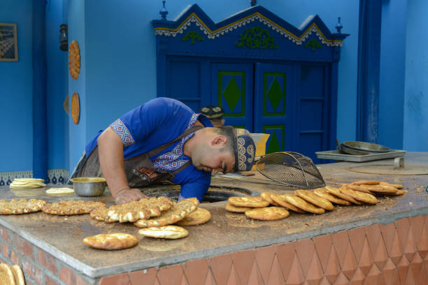 a naan maker was making naan in his shop. - peanut butter crackers stock pictures, royalty-free photos & images