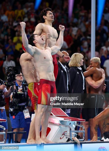 Qin Haiyang and Xu Jiayu of Team People's Republic of China celebrate after winning gold in the Men's 4x100m Medley Relay Final on day nine of the...