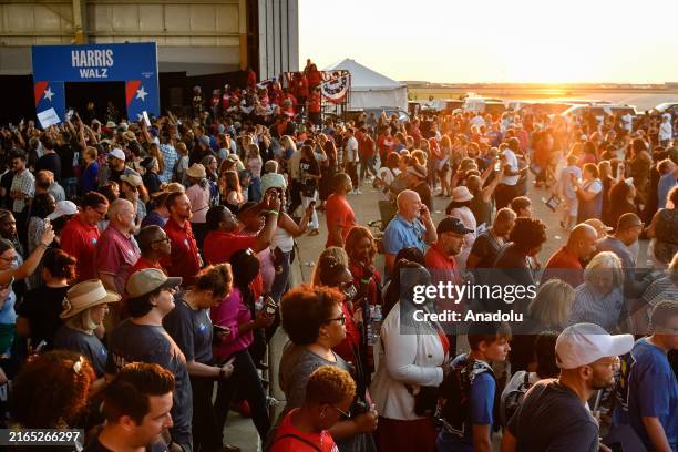 Attendees begin to exit the Signature Aviation Hanger as Vice President Kamala Harris and Governor Tim Walz's presidential campaign rally at Detroit...