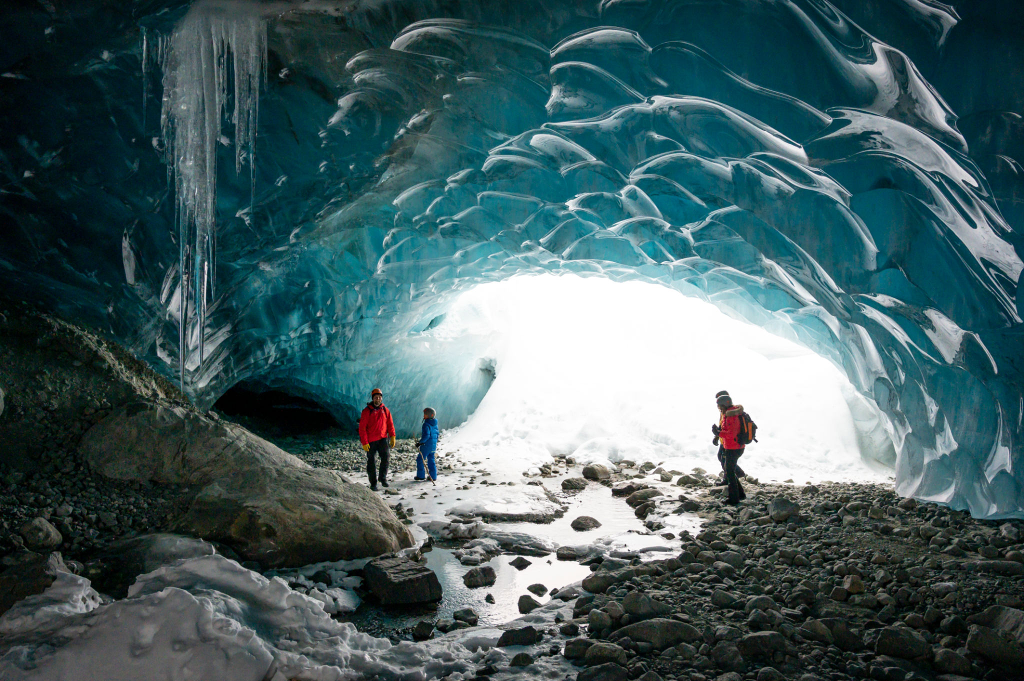 Guide leads guests on ice-cave tour Guide leads guests on ice-cave tour