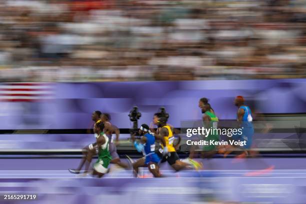Shaun Maswanganyi of Team South Africa, Chitutu Ali of Team Italy, Emmanuel Eseme of Team Cameroon, Oblique Seville of Team Jamaica, Louie Hinchliffe...