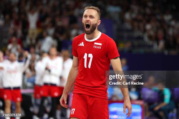 Pawel Zatorski of Team Poland celebrates after scoring a point during the Men's Quarterfinal match between Team Slovenia and Team Poland on day ten...