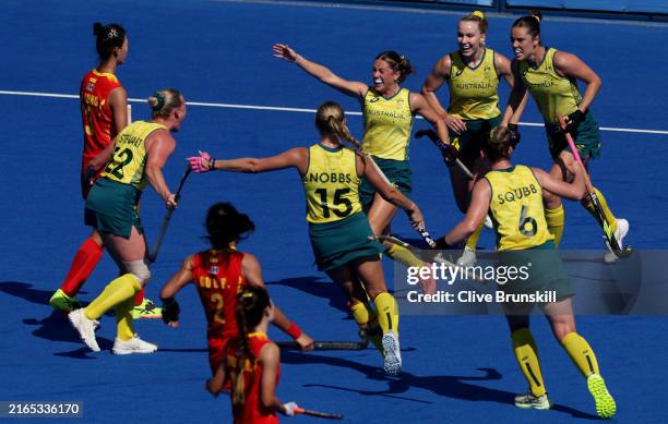 Tatum Stewart of Team Australia celebrates scoring her team's second goal with teammates during the Quarter Final Women's match between Australia and...