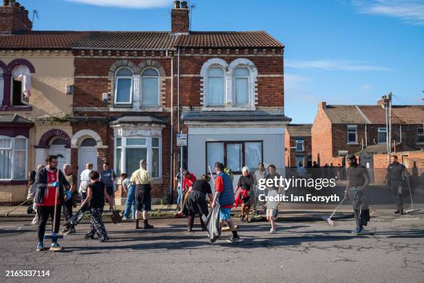 Members of the Middlesbrough community come together to clean up their streets after far-right activists destroyed property following riots on August...