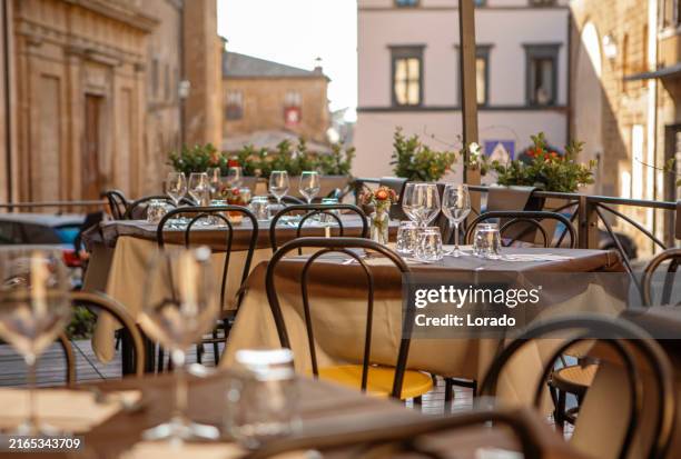 luxury travel restaurant dining locations in italy - italy restaurant stock pictures, royalty-free photos & images