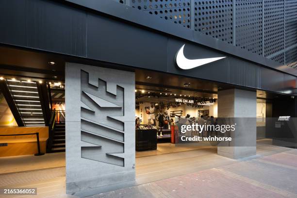 nike store in hongkong - markenname stock-fotos und bilder