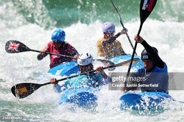 Manuel Ochoa of Team Spain and Jakub Grigar of Team Slovakia compete during the Canoe Slalom Men's Kayak Cross Quarterfinal One on day ten of the...