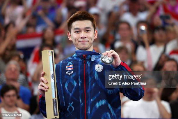 Silver medallist Kunlavut Vitidsarn of Team Thailand poses on the podium during the the Badminton Men's Singles medal ceremony after the Badminton...