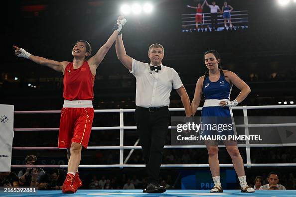 Li Quan Boxing China's Li Qian reacts after beating Australia's Caitlin Parker in ...