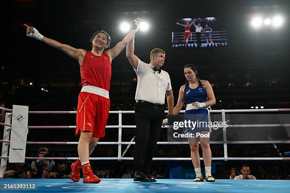 Li Quan Boxing China's Li Qian reacts after beating Australia's Caitlin Parker in ...