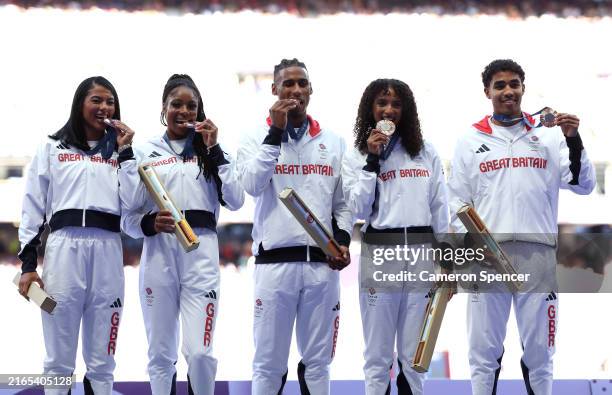 Bronze medalists of Team Great Britain celebrate on the podium during the 4 x 400m Relay Mixed medal ceremony on day ten of the Olympic Games Paris...