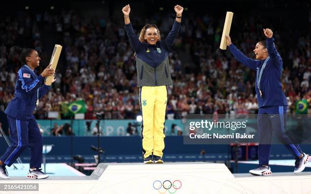 Gold medalist Rebeca Andrade of Team Brazil, silver medalist Simone Biles of Team United States and bronze medalist Jordan Chiles of Team United...