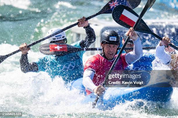 Timothy Anderson of Team Australia, Boris Neveu of Team France and Grzegorz Hedwig of Team Poland compete in the Canoe Slalom Men's Kayak Cross...