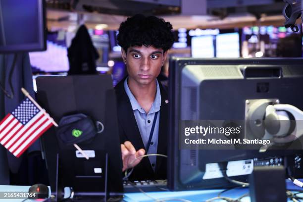 Traders work on the floor of the New York Stock Exchange during afternoon trading on August 05, 2024 in New York City. All three major indexes closed...