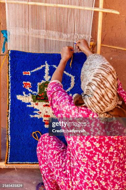 berber woman weaving textiles, ouarzazate, morocco - moroccan culture stock pictures, royalty-free photos & images