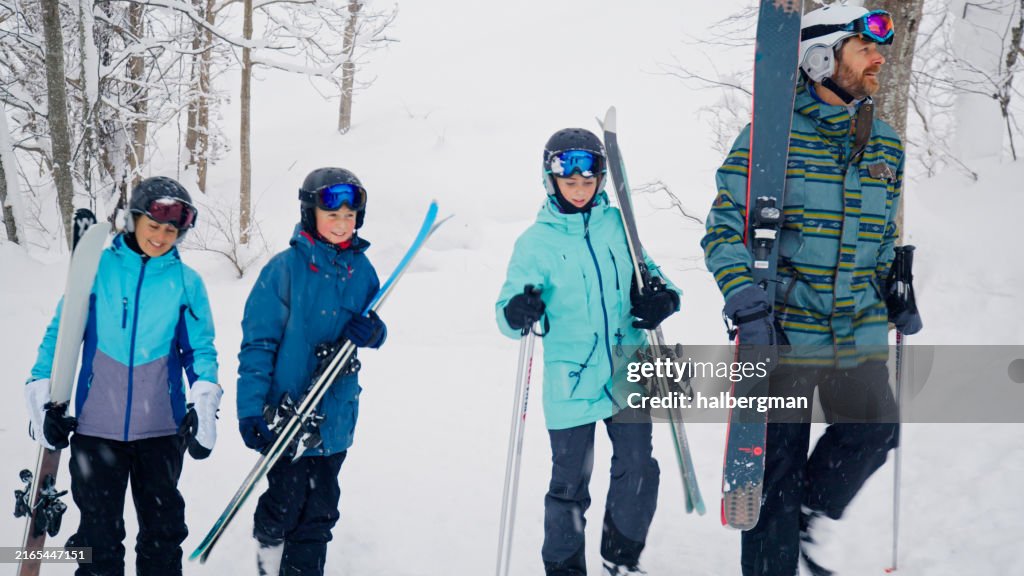 Family of Four About to Ski on a Mountain in Niseko, Japan