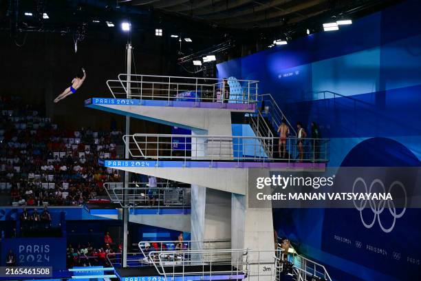 China's Cao Yuan competes in the men's 10m platform diving preliminary during the Paris 2024 Olympic Games at the Aquatics Centre in Saint-Denis,...