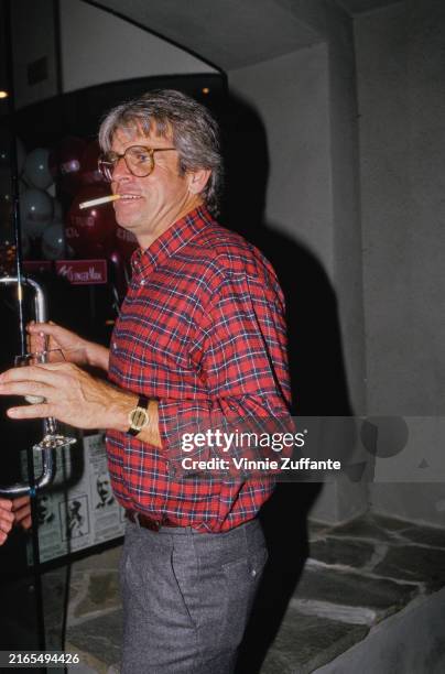 American actor William Devane wearing a plaid shirt, circa 1995.