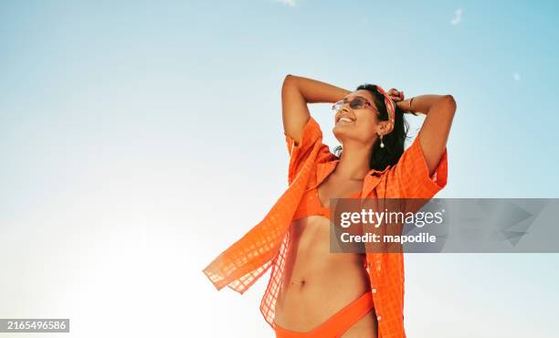 young woman in a bikini enjoying a day at the beach in summer - badkläder bildbanksfoton och bilder