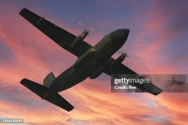 military cargo aircraft in the sunset sky (transall, german air force) - military transport aircraft stock pictures, royalty-free photos & images