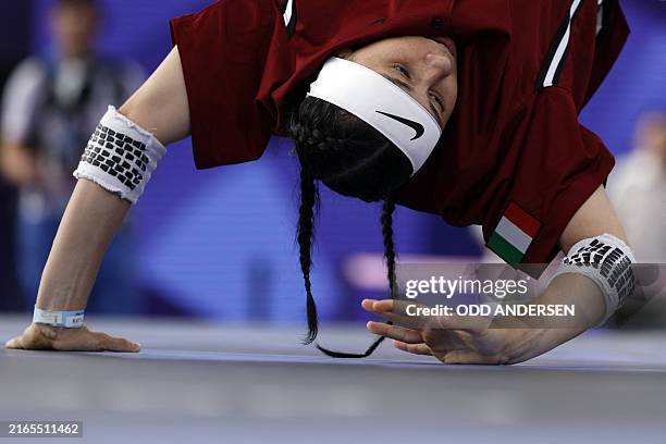 Italy's Antilai Sandrini, known as Anti competes in the Women's Breaking dance Round robin of the Paris 2024 Olympic Games at La Concorde in Paris,...