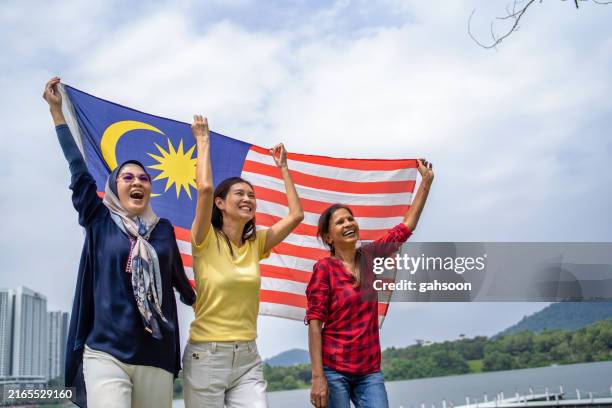 malaysian supporter on merdeka holiday - malaysian culture stock pictures, royalty-free photos & images