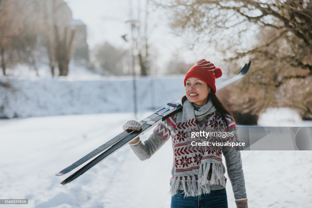 Woman going skiing on a beautiful winter day