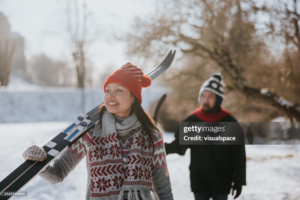 Friends going skiing together on a sunny winter day