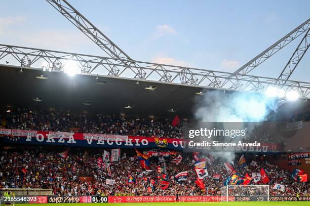 Genoa's fans wave their flags prior to kick-off in the Coppa Italia match between Genoa CFC and Reggiana at Stadio Luigi Ferraris on August 9, 2024...