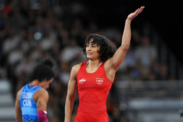 Vinesh Vinesh of Team India celebrates victory against Yusneylis Guzman Lopez of Team Cuba during the Wrestling Women's Freestyle 50kg Semifinal on...