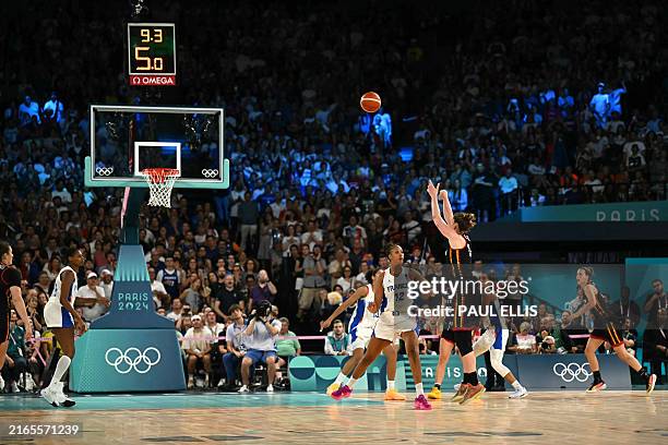 Belgium's Emma Meesseman scores a three-point field goal to equalize 66-66 five seconds before the end of the last quarter in the women's semifinal...