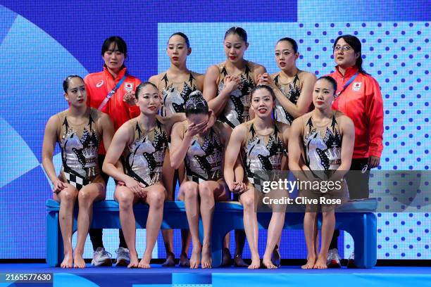 Members of Team Japan react after competing in the Team Free Routine on day eleven of the Olympic Games Paris 2024 at Aquatics Centre on August 06,...