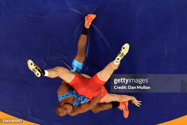Artur Aleksanyan of Team Armenia competes with Gabriel Alejandro Rosillo Kindelan of Team Cuba during the Wrestling Men's Greco-Roman 97kg Semifinal...