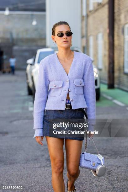 Vera van Erp wears lavender jacket, denim skirt, Chanel bag outside Joao Maraschin during day two of the Copenhagen Fashion Week SS25 on August 06,...