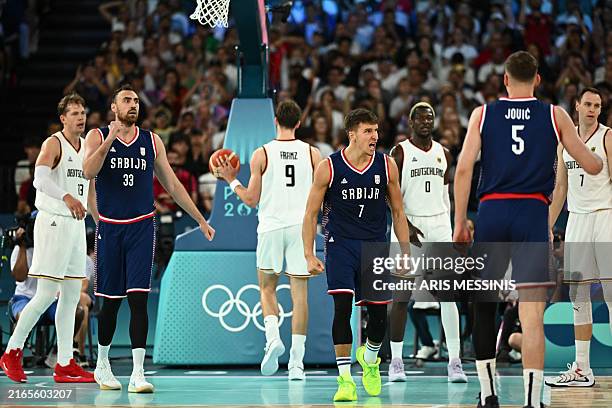 Serbia's Bogdan Bogdanovic celebrates after scoring in the men's Bronze Medal basketball match between Germany and Serbia during the Paris 2024...