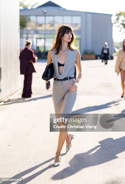 Justine Soranzo wears grey blouse, shorts, black bag outside Remain during day two of the Copenhagen Fashion Week SS25 on August 06, 2024 in...