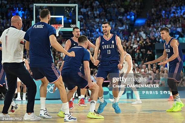 Serbia's Ognjen Dobric celebrates after scoring in the men's Bronze Medal basketball match between Germany and Serbia during the Paris 2024 Olympic...