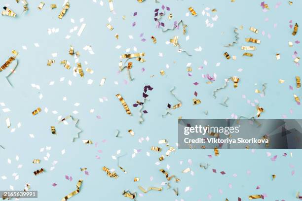 colored confetti flying on blue background - congratulations script stock pictures, royalty-free photos & images