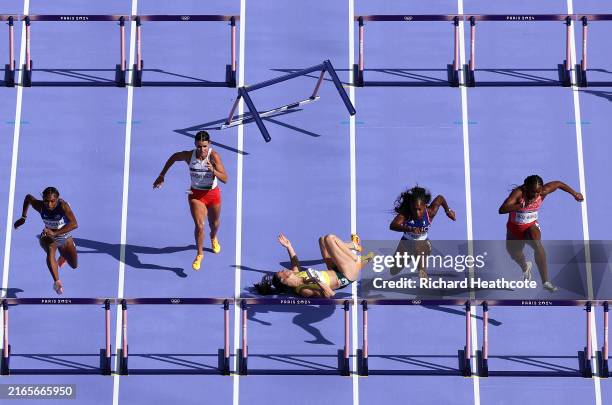 Michelle Jenneke of Team Australia knocks over a hurdle during the Women's 100m Hurdles Round 1 on day twelve of the Olympic Games Paris 2024 at...