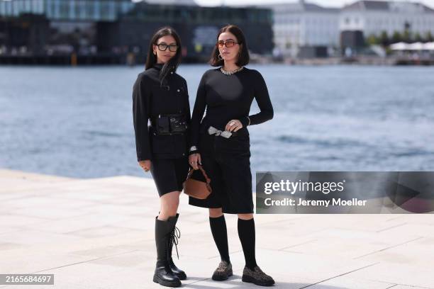 Fashion Week guest is seen wearing glasses with bold black frame, several golden hoop earrings, a black jacket with silver buttons, a black leather...