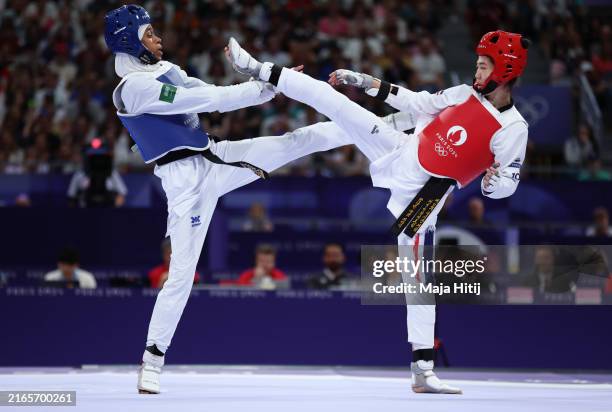 Dunya Ali M Abutaleb of Team Saudi Arabia and Panipak Wongpattanakit of Team Thailand compete during the Women’s Taekwondo -49kg Quarterfinal match...