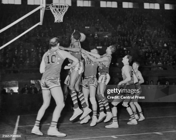 The Harlem Globetrotters in action against Stars of America during an exhibition match at Wembley, London, UK, 16th May 1950.