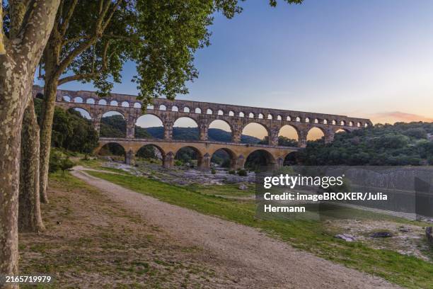 the pont du gard is a roman aqueduct in the south of france - gard stock pictures, royalty-free photos & images