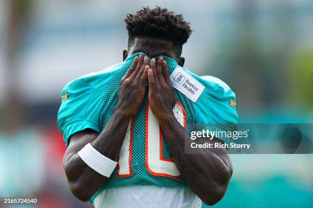 Tyreek Hill of the Miami Dolphins looks on during training camp practice with the Atlanta Falcons on August 07, 2024 in Miami Gardens, Florida.