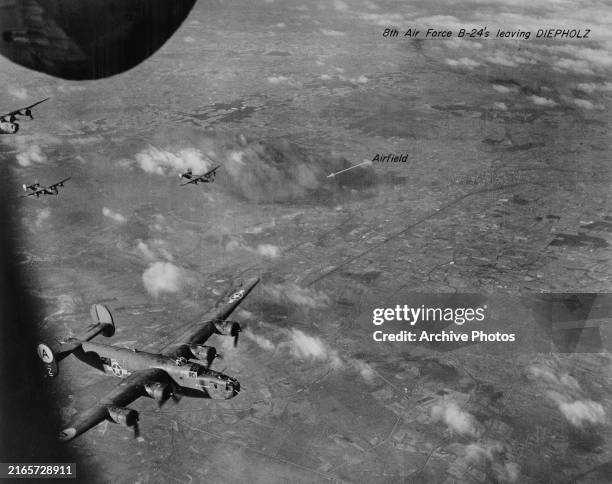 Consolidated B-24 Liberator four engined heavy bombers, including a B-24 nicknamed Greenwich from the 506th Bomber Squadron, 44th Bombardment Group,...
