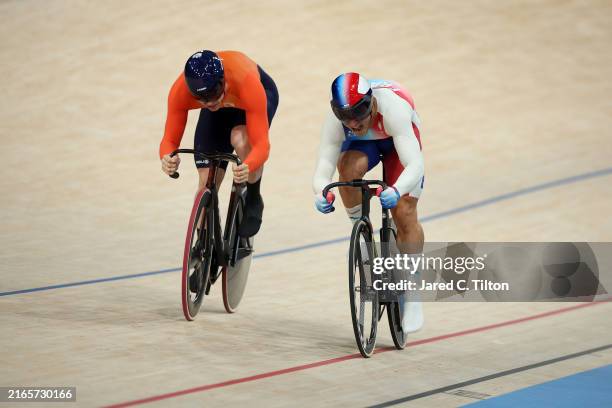 Harrie Lavreysen of Team Netherlands and Rayan Helal of Team France compete during the Men's Sprint 1/16 Finals on day twelve of the Olympic Games...