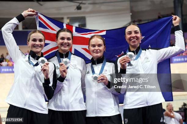 Silver medalists Ally Wollaston, Bryony Botha, Emily Shearman, and Nicole Shields of Team New Zealand pose on the podium after the Women's Team...